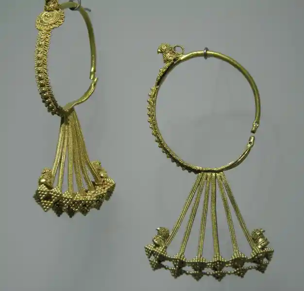 Gold temple pendants with pyramid-like design